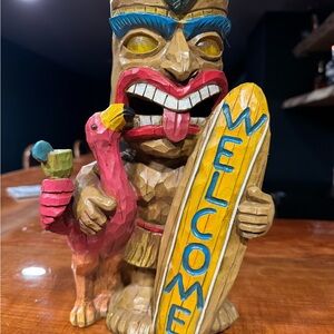 Colorful Tiki Statue with Welcome Sign